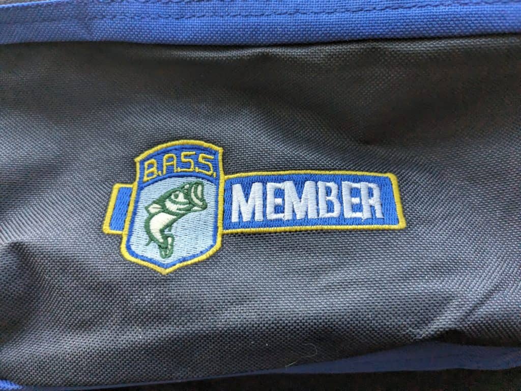 BASS membership bag given to anglers upon membership purchase, featuring fishing logos and accessories.