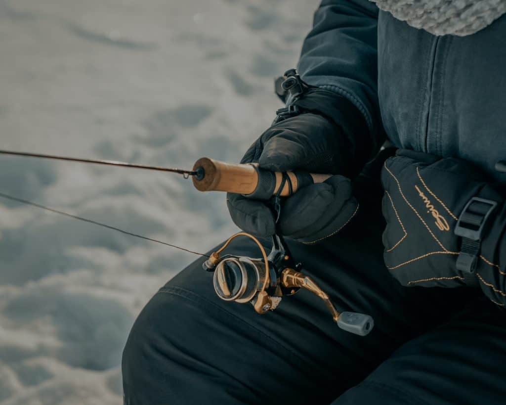 Ice fishing for bass in ponds.