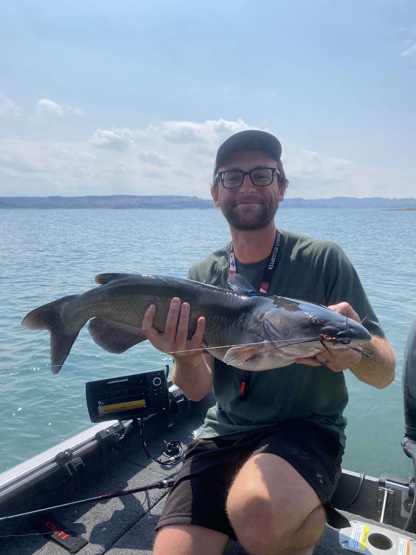 Catfishing with jigs on large lake.